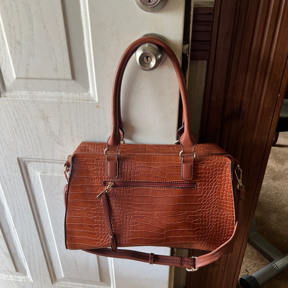 Beautiful crocodile handbag. 15 1/2 wide 9 1/2 tall. Used once.